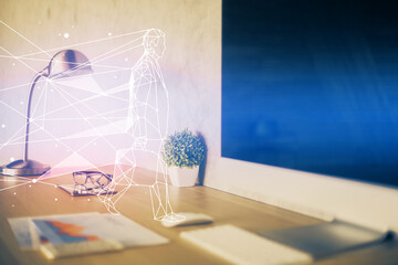 Desktop computer background in office and start up theme hologram drawing. Double exposure. Startup concept.