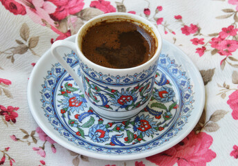 a cup of Turkish coffee on fabric background
