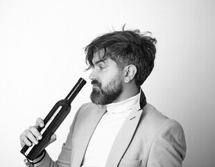 Anonymous alcoholic person drinking from a bottle of alcohol.