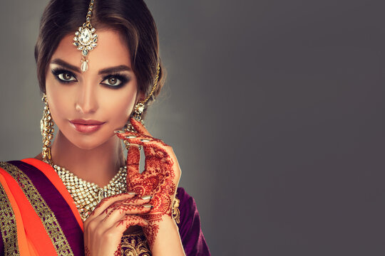 Portrait of a beautiful indian girl .India woman in traditional sari dress  and jewelry. Stock Photo | Adobe Stock