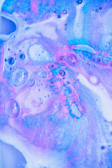Beautiful bath bomb dissolves in blue and pink colors in the water. Abstract background - 368600888