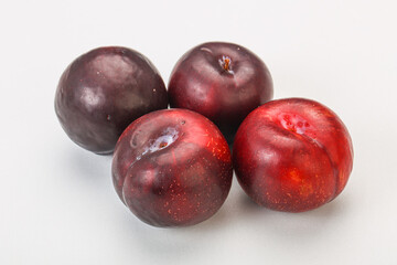Ripe sweet plum fruit heap