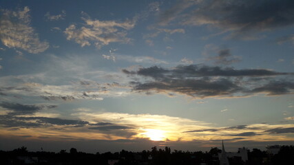 time lapse clouds over sunset