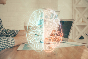 Man typing on keyboard background with brain hologram. Concept of big Data. Double exposure.