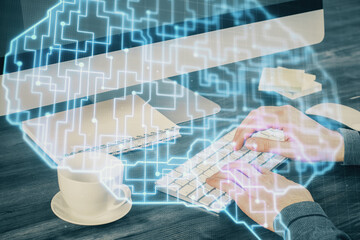 Man with computer background with brain theme hologram. Concept of brainstorm. Double exposure.