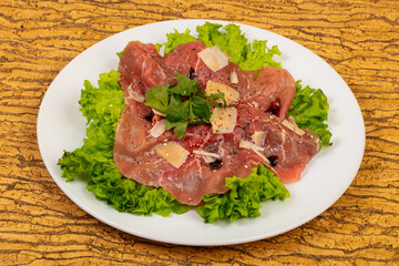 Beef carpaccio with parmesan cheese
