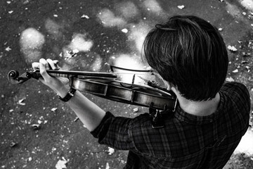 man in park with a violin