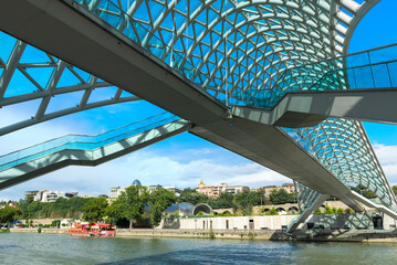 Peace Bridge over the Mtkvari river, Designed by Italian architect Michele de Lucci, Tbilisi,...
