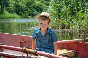 little boy fishing in a boat