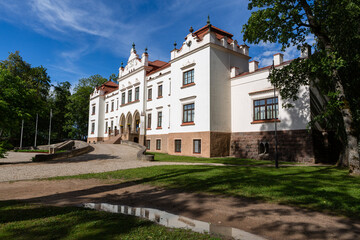 Fototapeta na wymiar Rokiskis manor and park in sunny summer day