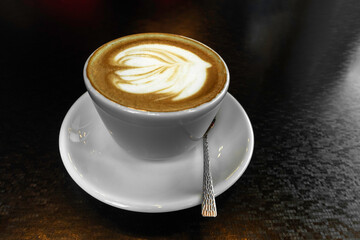 Cup of hot latte or cappuccino art coffee