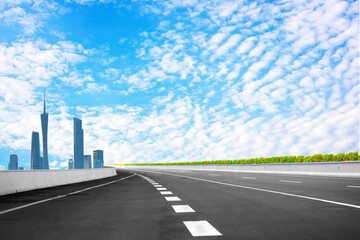 The setting sun shines on the road leading to the city center