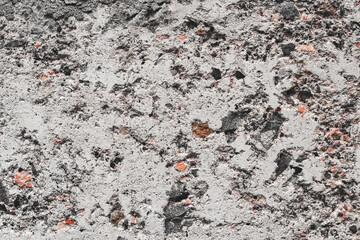 Texture of gray concrete close-up. interspersed with colored elements.