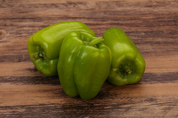 Three green bell juicy peppers