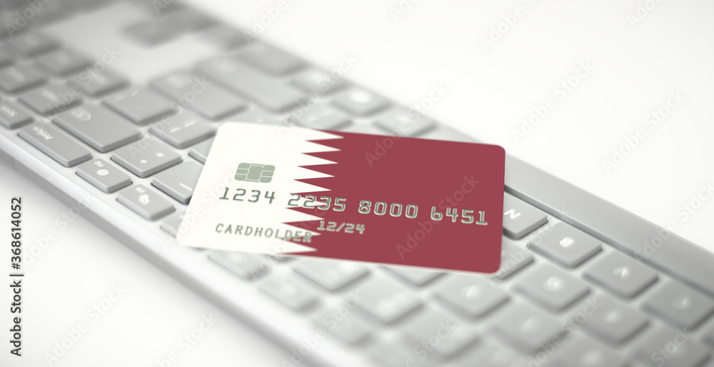 Poster plastic bank card depicting flag of qatar on computer keyboard. fictional numbers