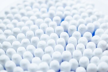 Cotton sticks ear blue plastic on a white background. Personal hygiene and care. Cosmetology and medicine.