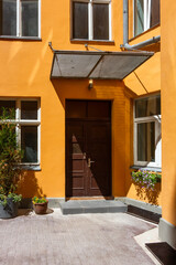 Fototapeta na wymiar orange house with a yard