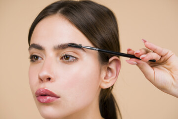 Womans eyebrows. Beauty and care. Beautiful girl with eyebrow brush. Girl with natural make up....