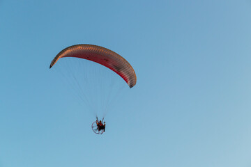 paragliding in the blue sky