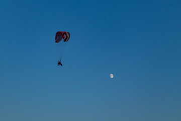 paragliding in the blue sky