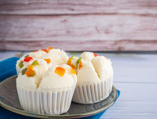Thai steamed cupcakes topped with dry fruit on plate