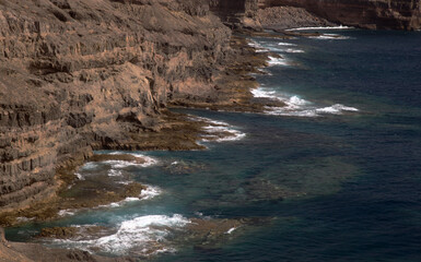 Gran Canaria, steep eroded coast line of Agaete municipality, path to Playa del Juncal beach 
