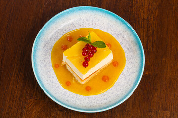 Traditional Cheesecake with orange sauce