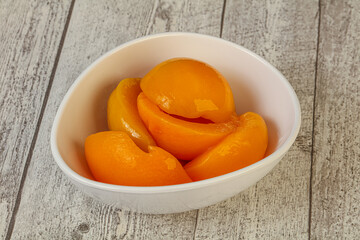 Marinated peaches fruit in the bowl