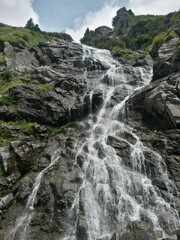 Obraz premium small waterfall at mountain in spring season