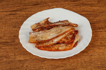 Roasted juicy bacon in the plate