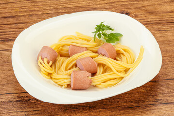 Kids pasta spaghetti with sausages