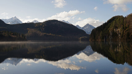Panoramic view of Bavarian Alps mirroring in Alpsee lake, Fussen, Germany