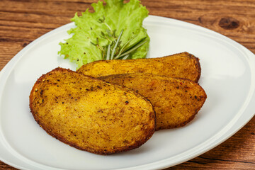 Baked potato with herbs and spices