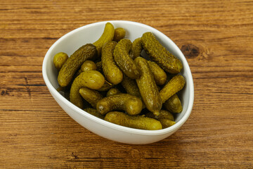 Pickled gherkin in the bowl