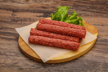 Raw beef sausages with spices