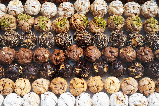 Traditional Rothenburg Schneeball sweet pastry in many varieties with chocolate, pistachio or sugar