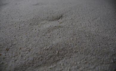 Sand in Dunkelgrau