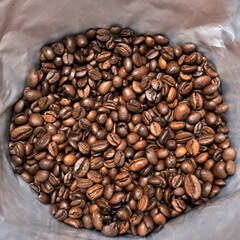 Open package with roasted coffee beans.
