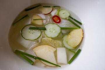 Korean watery kimchi made of sliced vegetable.