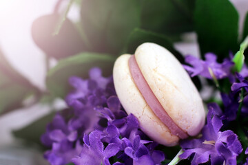 White macaroon with purple flowers, macro