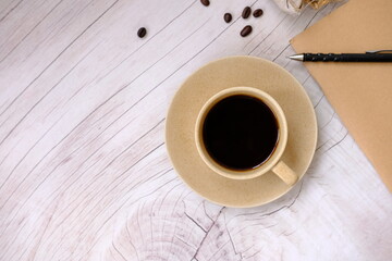 cup of coffee on wooden table