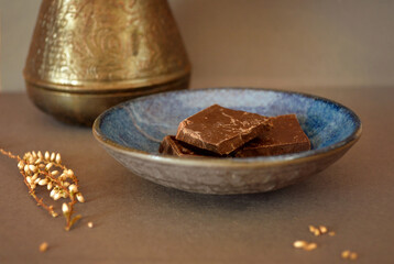 Coffee and a plate of chocolates