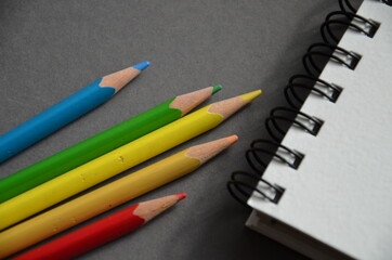 Colored pencils and a notebook