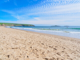 An almost deserted Aberdaron beach in Wales on a summer day