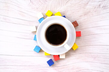cup of coffee with paper on wooden table