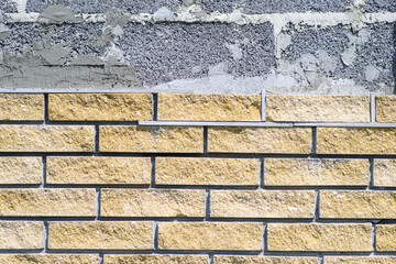 Wall cladding with decorative bricks, front view. Material for decorating the wall of house or fence
