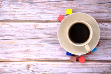 cup of coffee on wooden table