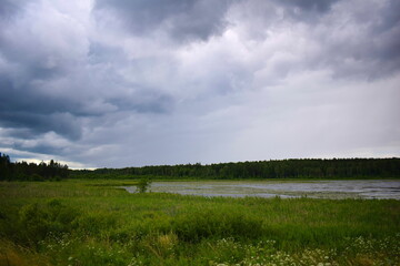 Fototapeta na wymiar clouds over lake in the Nature Park Vishtynetskiy