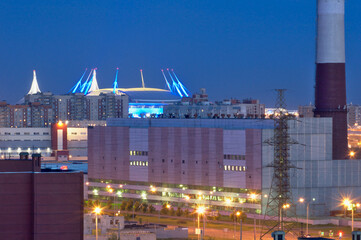 The evening view of the Zenith Arena stadium in St. Petersburg captures the city buildings of both residential and non-residential purposes.
