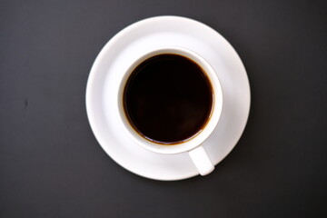 Top view coffee cup and coffee beans on old wood table background, space for text